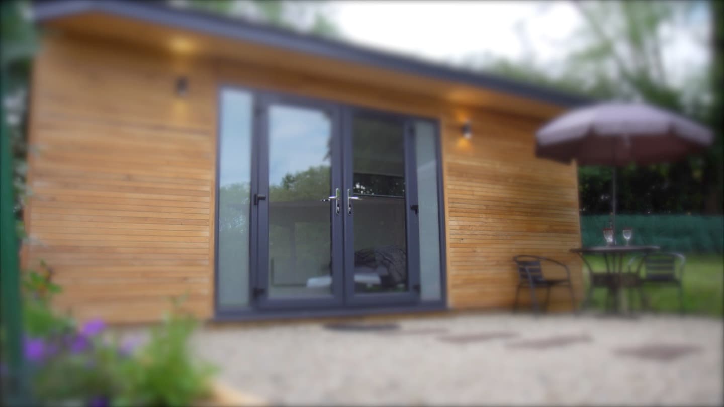 Private hot tub glamping pod Norfolk at dusk